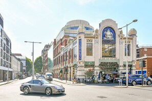 A street view with a building featuring a large sign reading "MICHELIN".