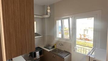 Apartment | Private kitchen | Full-sized fridge, oven, electric kettle, toaster