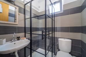 Shower, rainfall showerhead, hair dryer, towels