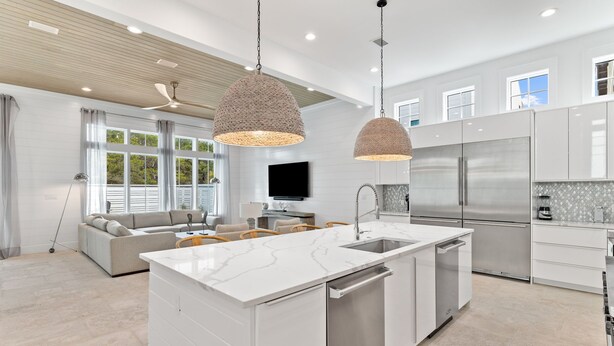 A modern kitchen with white cabinetry, stainless steel appliances, and pendant lighting. - Seven Palms Pinnacle|Easy Beach Access|New Construction|Private Pool|Gulf Views (Inlet Beach)