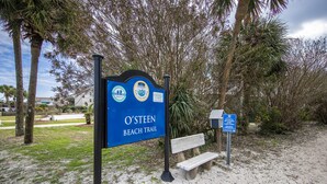 A beach trail sign with a bench nearby. - Island Home #102 | Close to Beach and Destin Harbor (Destin)