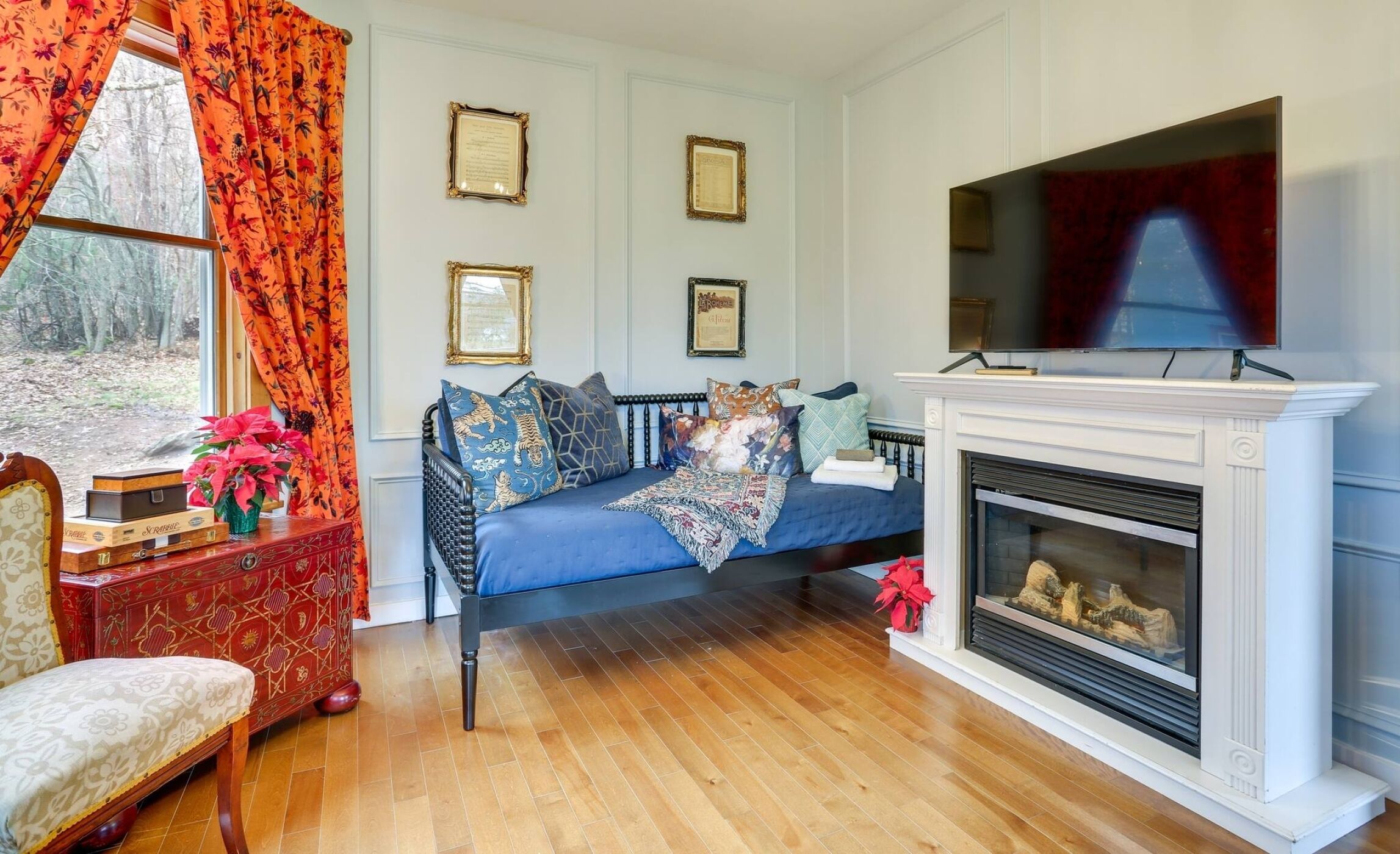 Cozy parlor with fireplace, TV, and a perfect spot for late-night conversation
