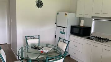 Full-sized fridge, microwave, stovetop, electric kettle