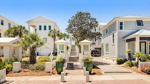 A residential street with houses, a central staircase, and a tree. - ☀️Short, Easy Walk to Carillon Beach-Pool + Hot Tub-Tennis Court-Lily Pad☀️ (Panama City Beach)