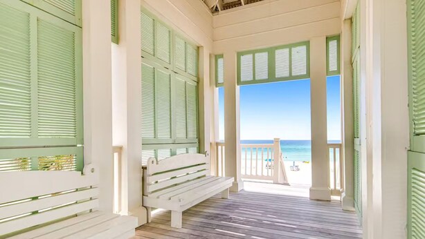A wooden deck with a bench and green shutters, leading to a beach with a railing. - ☀️Short, Easy Walk to Carillon Beach-Pool + Hot Tub-Tennis Court-Lily Pad☀️ (Panama City Beach)