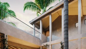 A modern multi-level interior with a central courtyard, featuring a pool, lush greenery, and a staircase.