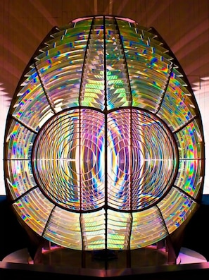 A large, circular stained glass window with a symmetrical design. - Point Arena Lighthouse - Keeper's Room (Point Arena)