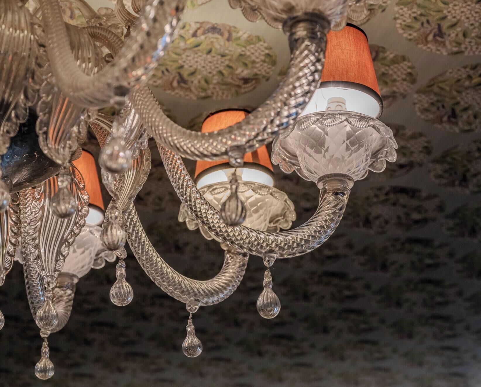 A chandelier with intricate metalwork and multiple light fixtures.
