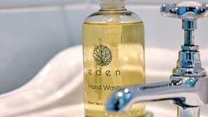 A bathroom sink with a bottle of Eden Hand Wash and a faucet. - Jasmine Country Cottage (Dorrington)