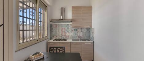 Fridge, stovetop, coffee/tea maker, cookware/dishes/utensils