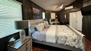 A bedroom with a bed, dresser, desk, and wardrobe. - Mountain house in Fancy Gap with beautiful view and hot tub on deck (Fancy Gap)