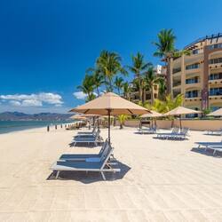 On the beach, sun loungers, beach towels