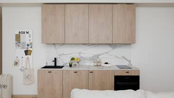 Una cocina moderna con armarios de madera, un salpicadero de mármol y un fregadero.