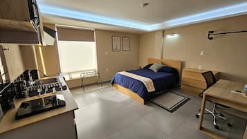 Suite Deluxe, vista a la ciudad | 1 habitación y ropa de cama de alta calidad