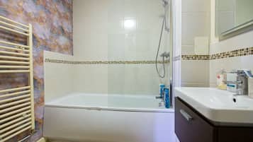Apartment | Bathroom | Separate tub and shower, deep soaking tub, towels, toilet paper