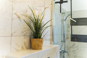 Shower, hair dryer, towels, toilet paper