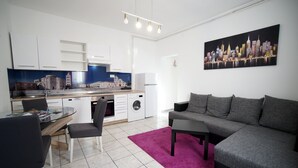 A modern apartment with a dining area, kitchen, and living room. - Apartments Silver Shade - One Bedroom Apartment with Terrace(a1) (Zadar)
