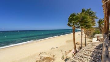 On the beach, sun loungers, beach towels