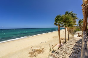 On the beach, sun loungers, beach towels
