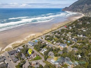 An aerial view of a coastal residential area with houses, a beach, and the ocean. - Private Idaho by Manzanita Beach Getaway: Hot Tub, Dog-Friendly & Near Beach (Manzanita)