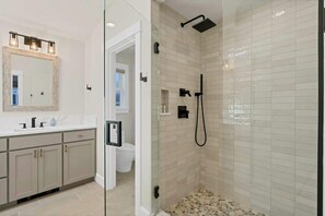Shower, hair dryer, towels, shampoo