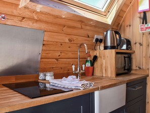 A compact kitchen with a sink, a kettle, a toaster, and a microwave. - 2 bedroom accommodation in Corney, near Millom (Corney, near Millom)