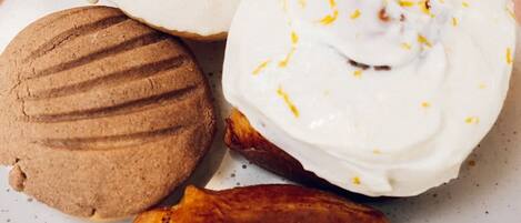 A plate with four different pastries.