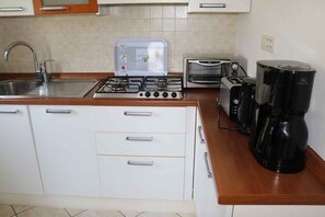Microwave, stovetop, coffee/tea maker, toaster