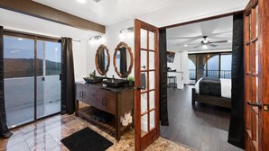 A modern bathroom with a vanity, two mirrors, and a shower area. - Beautiful Fallbrook Estate Ideal for Weddings and Events (Fallbrook)