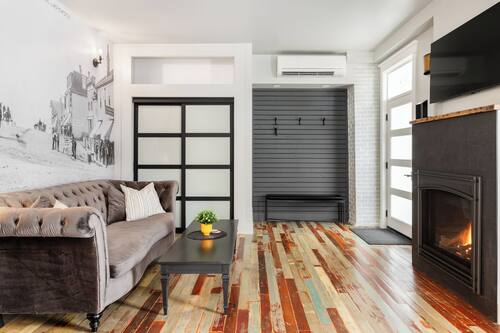 Suite, 1 Queen Bed | Living area | Fireplace