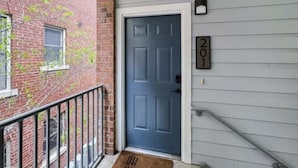 A grey door with a number plate '201' and a small mailbox on the wall. - BLUES LANDING
The best stay between Main and the Mississippi!! (Memphis)