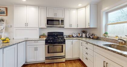 Ideally located home with yard, grill, bikes, gas fireplace, streaming, W/D, AC