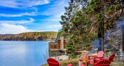 Lovely lakefront estate with boathouse, pickleball, firepit, & stunning view