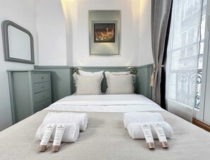 1 bedroom, desk, iron/ironing board, travel cot