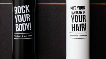 Two bottles of personal care products with text on them.
