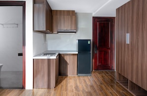 Enjoy cooking in this well-equipped kitchen with a stainless steel sink and modern cabinetry.