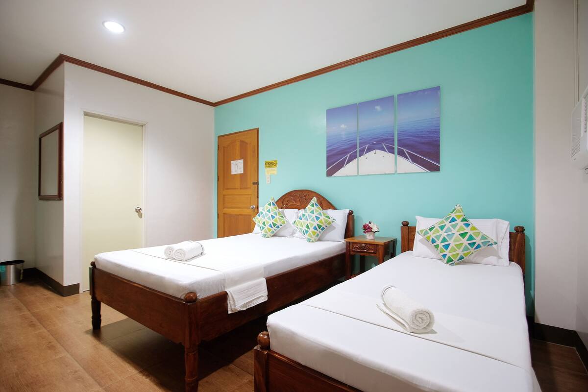 Habitación triple superior | Ropa de cama
