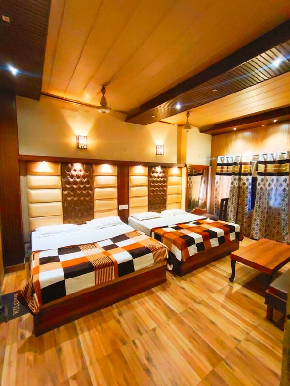 Deluxe Quadruple Room, City View | Free WiFi, bed sheets - Goroomgo Hotel Revoli Amritsar (Amritsar)