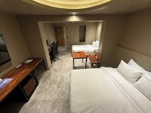 Habitación Deluxe con 2 camas individuales | Ropa de cama de alta calidad y edredones de plumas