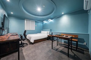 Standard Double Room | Living area | 55-inch LCD TV with cable channels, Netflix, computer