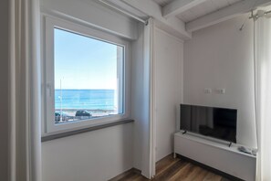 Superior Apartment, Sea View | Living area | Flat-screen TV