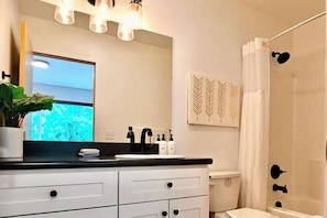 Shower, hair dryer, towels