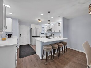 Fridge, microwave, oven, dishwasher - Stunning Ocean-View Condo | Steps to Pool & Beach | Perfect for Families & (St. Augustine Beach)