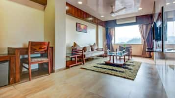 Premier Room | Living area | 144-inch LCD TV with cable channels