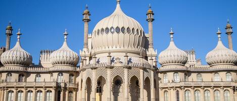 A large, ornate building with multiple domes and minarets, likely a historical or cultural landmark.