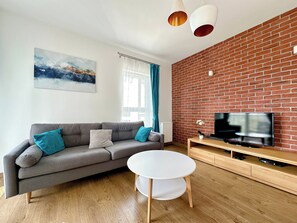 Superior Apartment, 3 Bedrooms | Living room | Flat-screen TV