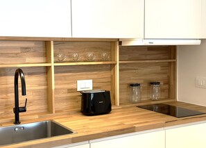 Fridge, microwave, stovetop, coffee/tea maker