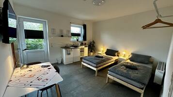 Apartment, 2 Single Beds | 1 bedroom, blackout curtains, soundproofing, iron/ironing board