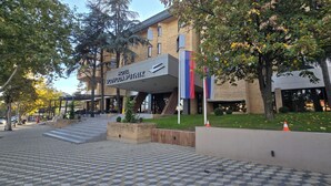 Hotel Vojvoda Punitik with a modern design, a checkered tile entrance, and a flagpole. - Vojvoda Putnik (Vranje)