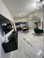 Deluxe Studio | Living area | 80-cm Smart TV with digital channels, fireplace